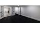 Basement featuring plush carpet and easy access to the backyard through beautiful glass panel doors at 4 Bentley Trace Mnr, Atlanta, GA 30327