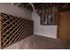 Custom wine rack storage with electrical box and wooden slats offering functional storage at 4 Bentley Trace Mnr, Atlanta, GA 30327