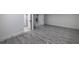 Spacious finished basement area with wood-look tile flooring at 4 Bentley Trace Mnr, Atlanta, GA 30327