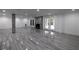 Finished basement with wood-look flooring, fireplace, exterior access and modern lighting at 4 Bentley Trace Mnr, Atlanta, GA 30327