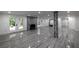 Spacious finished basement with stone fireplace and wood-look tile flooring at 4 Bentley Trace Mnr, Atlanta, GA 30327