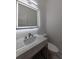 Modern bathroom featuring a lighted mirror, vessel sink, and marble countertop with a commode to the right at 4 Bentley Trace Mnr, Atlanta, GA 30327