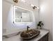 Bathroom vanity featuring vessel sink, marbled countertop and gold hardware at 4 Bentley Trace Mnr, Atlanta, GA 30327