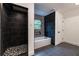 Modern bathroom features a walk-in shower, a soaking tub with mosaic accent wall, and tile floors at 4 Bentley Trace Mnr, Atlanta, GA 30327