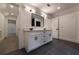 Spacious bathroom with double sinks, a large mirror, and sleek gray floor tiles at 4 Bentley Trace Mnr, Atlanta, GA 30327