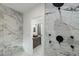 Bathroom featuring a stylish vanity with a marble tile shower in the background at 4 Bentley Trace Mnr, Atlanta, GA 30327