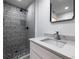 Bathroom featuring tiled shower and stylish vanity at 4 Bentley Trace Mnr, Atlanta, GA 30327