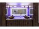 Stylish bathroom with a double vanity, vessel sinks, and illuminated mirrors at 4 Bentley Trace Mnr, Atlanta, GA 30327