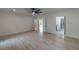Bright bedroom featuring hardwood floors, white trim, and a modern ceiling fan at 4 Bentley Trace Mnr, Atlanta, GA 30327