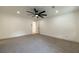Bright bedroom with ceiling fan, recessed lighting, and doorway to bathroom at 4 Bentley Trace Mnr, Atlanta, GA 30327