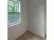 An empty bedroom features a single window and hardwood flooring at 4 Bentley Trace Mnr, Atlanta, GA 30327
