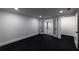 Finished basement bedroom with recessed lighting and access to modern living area at 4 Bentley Trace Mnr, Atlanta, GA 30327