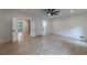 Bright bedroom with hardwood floors, ceiling fan, and white trim at 4 Bentley Trace Mnr, Atlanta, GA 30327