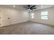 Bright bedroom featuring hardwood floors, ceiling fan, and windows at 4 Bentley Trace Mnr, Atlanta, GA 30327