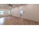 Expansive bedroom featuring hardwood floors, white trim, and plenty of natural light at 4 Bentley Trace Mnr, Atlanta, GA 30327