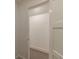 A neutral-colored, carpeted walk-in closet offers ample storage space at 4 Bentley Trace Mnr, Atlanta, GA 30327
