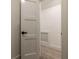 Neutral colored walk-in closet featuring base molding, and crisp white walls at 4 Bentley Trace Mnr, Atlanta, GA 30327