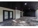 Covered patio features neutral brick pillars and ceiling, and decorative stone flooring at 4 Bentley Trace Mnr, Atlanta, GA 30327