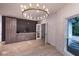 Dining room with chandelier, hardwood floors, and built-in storage cabinets at 4 Bentley Trace Mnr, Atlanta, GA 30327