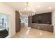 Dining room with stylish chandelier, custom cabinetry, and hardwood floors at 4 Bentley Trace Mnr, Atlanta, GA 30327