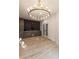 Dining area featuring modern lighting, elegant built-ins, and beautiful hardwood floors at 4 Bentley Trace Mnr, Atlanta, GA 30327