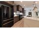 Contemporary kitchen featuring stainless steel appliances, a large island, and stylish pendant lighting at 4 Bentley Trace Mnr, Atlanta, GA 30327