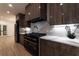 Contemporary kitchen boasts custom cabinets, marble countertops, a modern range hood, and a suite of appliances at 4 Bentley Trace Mnr, Atlanta, GA 30327
