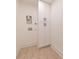 A compact laundry area featuring functional white storage cabinets and wall hookups at 4 Bentley Trace Mnr, Atlanta, GA 30327