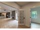 Hardwood floors lead to a living room, kitchen, and bonus room that let in lots of natural light at 4 Bentley Trace Mnr, Atlanta, GA 30327