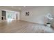 Open-concept living room with hardwood floors, modern fireplace, and natural light at 4 Bentley Trace Mnr, Atlanta, GA 30327