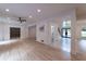 Spacious living room with hardwood flooring, recessed lighting, a ceiling fan, and access to outdoor space at 4 Bentley Trace Mnr, Atlanta, GA 30327