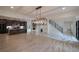 Bright, open-plan living space flows into a modern kitchen with stainless steel appliances and a dining area at 4 Bentley Trace Mnr, Atlanta, GA 30327