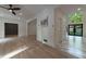 Bright living room with hardwood floors, white walls, and recessed lighting offers an open and airy feel at 4 Bentley Trace Mnr, Atlanta, GA 30327