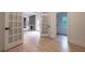Bright living room with hardwood floors and view of fireplace through glass doors at 4 Bentley Trace Mnr, Atlanta, GA 30327