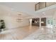Bright, open-concept living space featuring modern lighting, hardwood floors, and kitchen view at 4 Bentley Trace Mnr, Atlanta, GA 30327