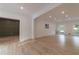 Open-concept living room with hardwood floors and ample light, perfect for entertaining and relaxing at 4 Bentley Trace Mnr, Atlanta, GA 30327