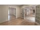 Open-concept design with hardwood floors, lots of natural light and doors leading to other rooms at 4 Bentley Trace Mnr, Atlanta, GA 30327