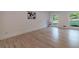 Bright living room with hardwood floors, large windows, and white trim at 4 Bentley Trace Mnr, Atlanta, GA 30327