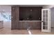 Modern living room boasts stylish cabinets, sleek countertops, and an abundance of natural light at 4 Bentley Trace Mnr, Atlanta, GA 30327