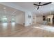 Open concept living space with hardwood floors, recessed lighting, and a modern ceiling fan at 4 Bentley Trace Mnr, Atlanta, GA 30327