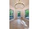 Bright living room with natural light, hardwood floors, and views of the landscaped yard at 4 Bentley Trace Mnr, Atlanta, GA 30327