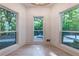 Sun-filled sitting room boasting hardwood floors and views of a lush landscape at 4 Bentley Trace Mnr, Atlanta, GA 30327