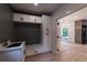 Mudroom with bench, cabinets and view of dining room at 4 Bentley Trace Mnr, Atlanta, GA 30327