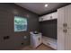 Mudroom with storage cabinets, sink, and bench at 4 Bentley Trace Mnr, Atlanta, GA 30327
