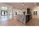 Bright, open floorplan featuring a kitchen island with eat in seating, hardwood floors and ample light at 4 Bentley Trace Mnr, Atlanta, GA 30327