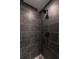 The shower features matte black tile with white grout and a mosaic-tiled shower floor at 4 Bentley Trace Mnr, Atlanta, GA 30327