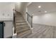Elegant staircase with wood treads, decorative railings, and ample natural light at 4 Bentley Trace Mnr, Atlanta, GA 30327