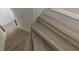 Elegant wooden staircase showcasing modern design and pristine white trim, offering access to multiple levels at 4 Bentley Trace Mnr, Atlanta, GA 30327