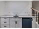 Charming wet bar featuring white cabinets, a sleek countertop, and a mini fridge, perfect for entertaining at 4 Bentley Trace Mnr, Atlanta, GA 30327