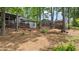 Large backyard with mature trees, a shed, and space for outdoor activities and landscaping at 4771 Pinefield Nw Dr, Acworth, GA 30102
